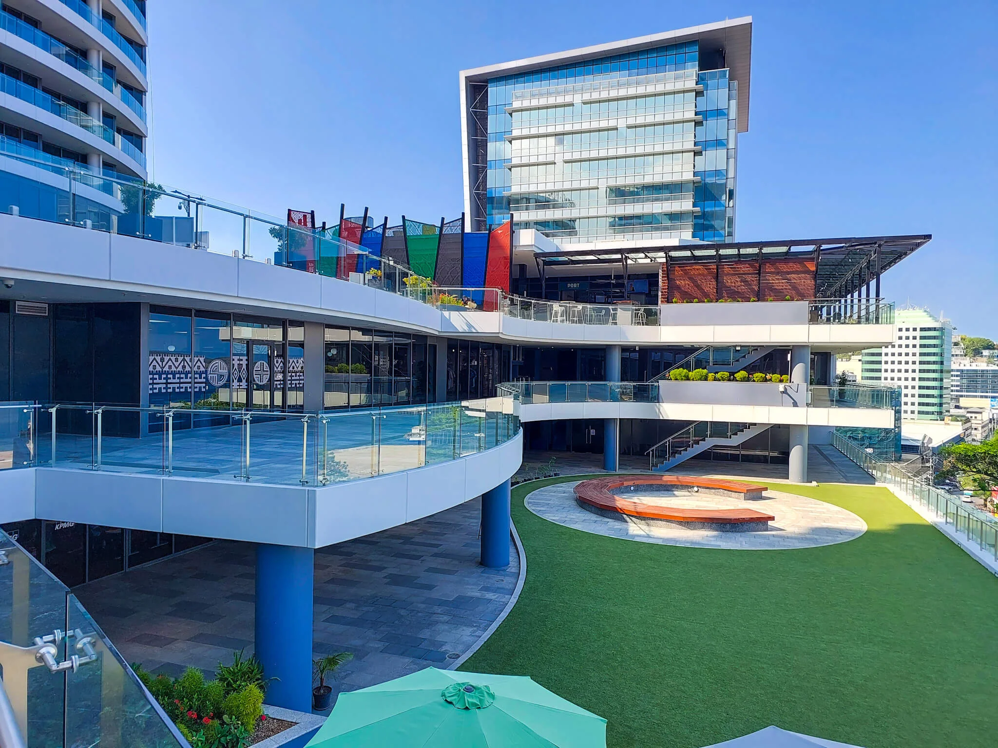 View of commercial plaza levels and lawn area with Deloitte Haus in the background