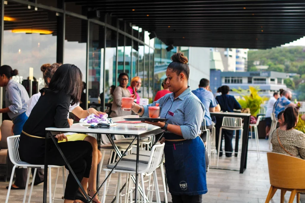 Waitress serving drinks at Port Terrace Restaurant and Bar