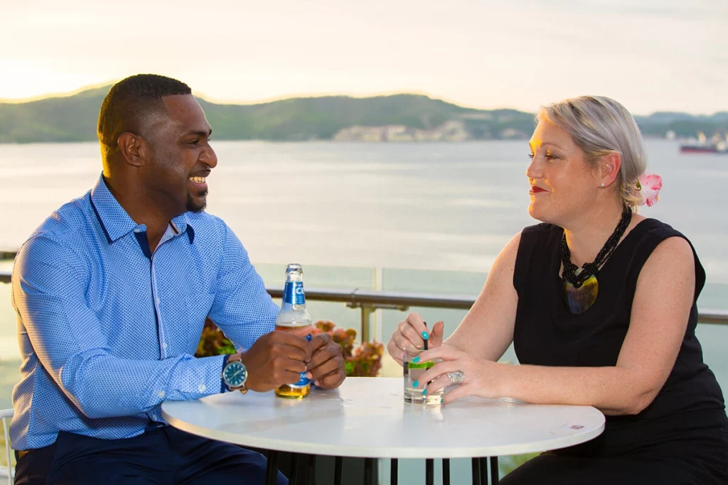 Couple sitting at table overlooking Fairfax Harbour